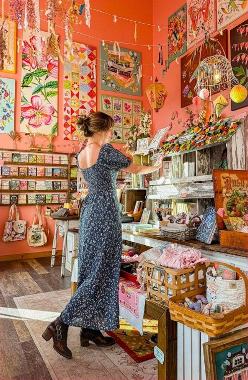 A shopper browsing a colourful independent boutique